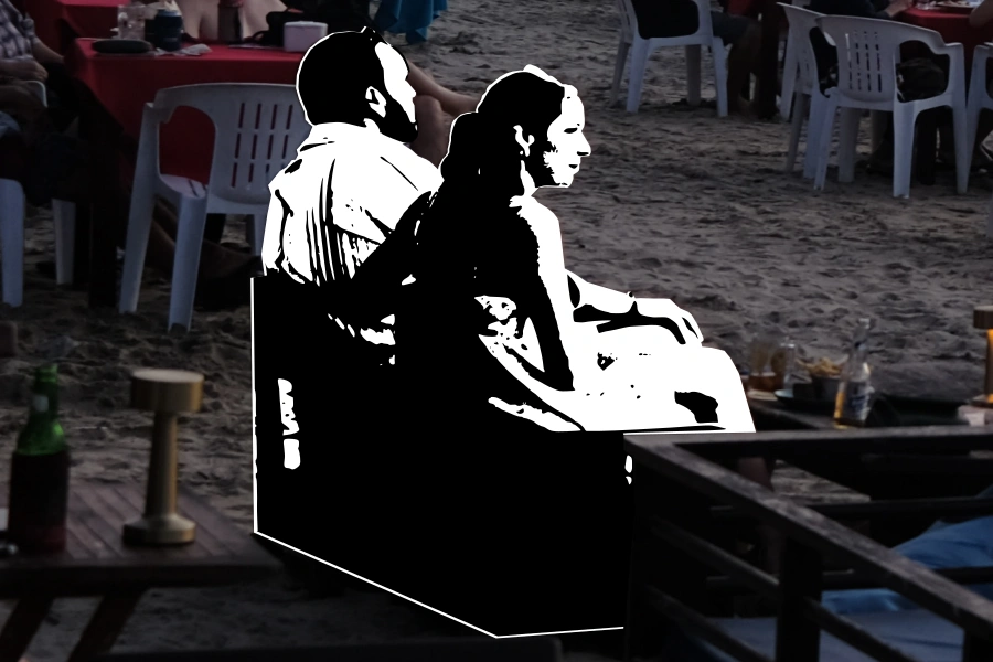 A couple watching the sunset at Djimbaran Beach